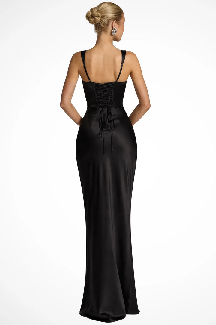Black corset lace-up gown on a model in a three-quarter turn