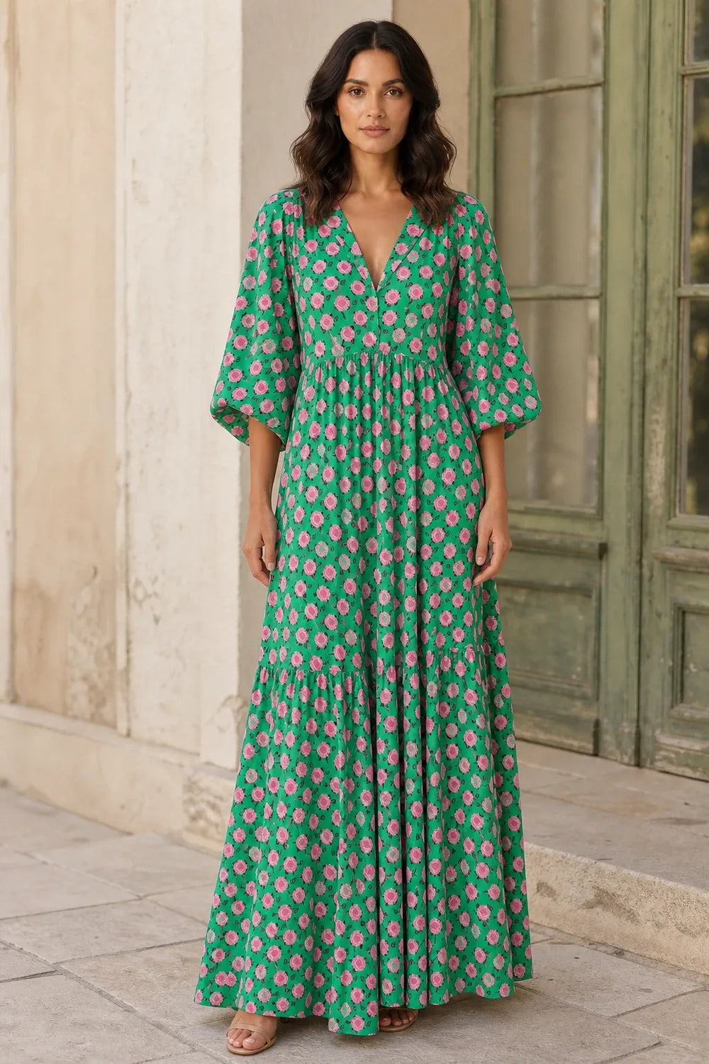 Green floral tiered maxi dress on model in contrapposto stance