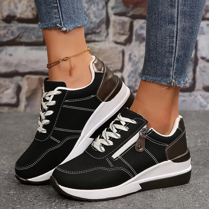 Black wedge platform sneaker, three-quarter angle view