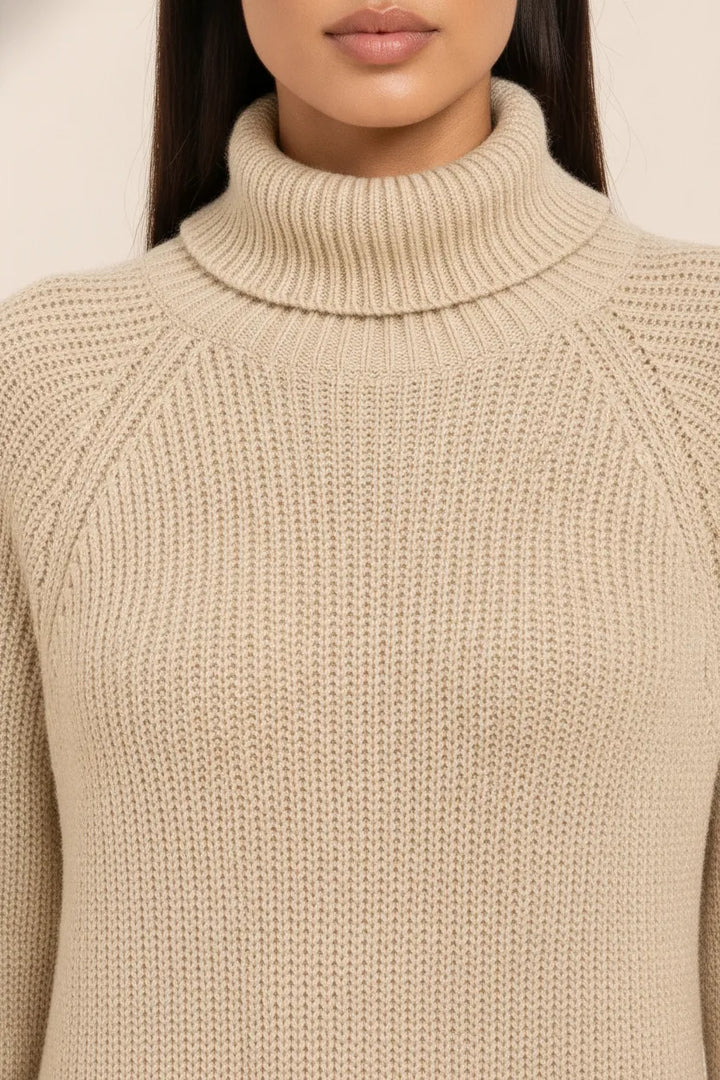 Close-up detail of a khaki turtleneck sweater dress