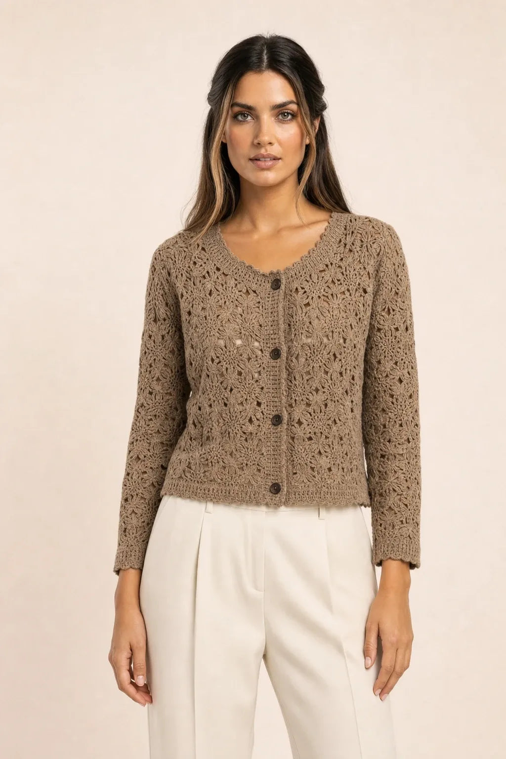 Khaki crochet scallop cardigan on model in contrapposto stance