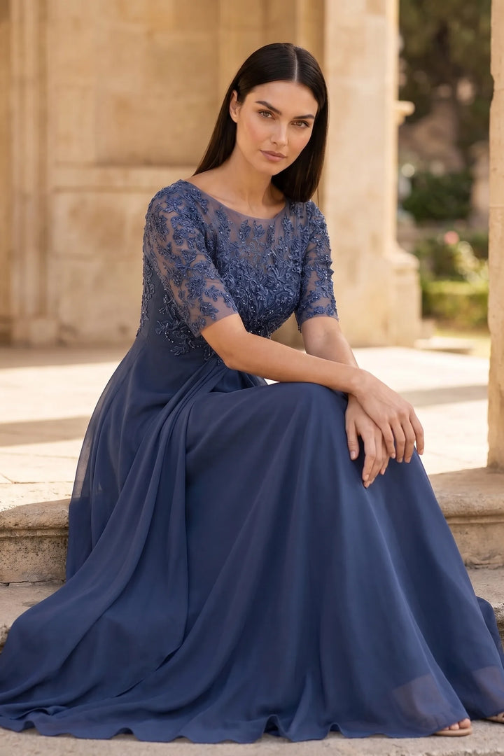 Model wearing blue lace illusion midi dress in outdoor lifestyle setting