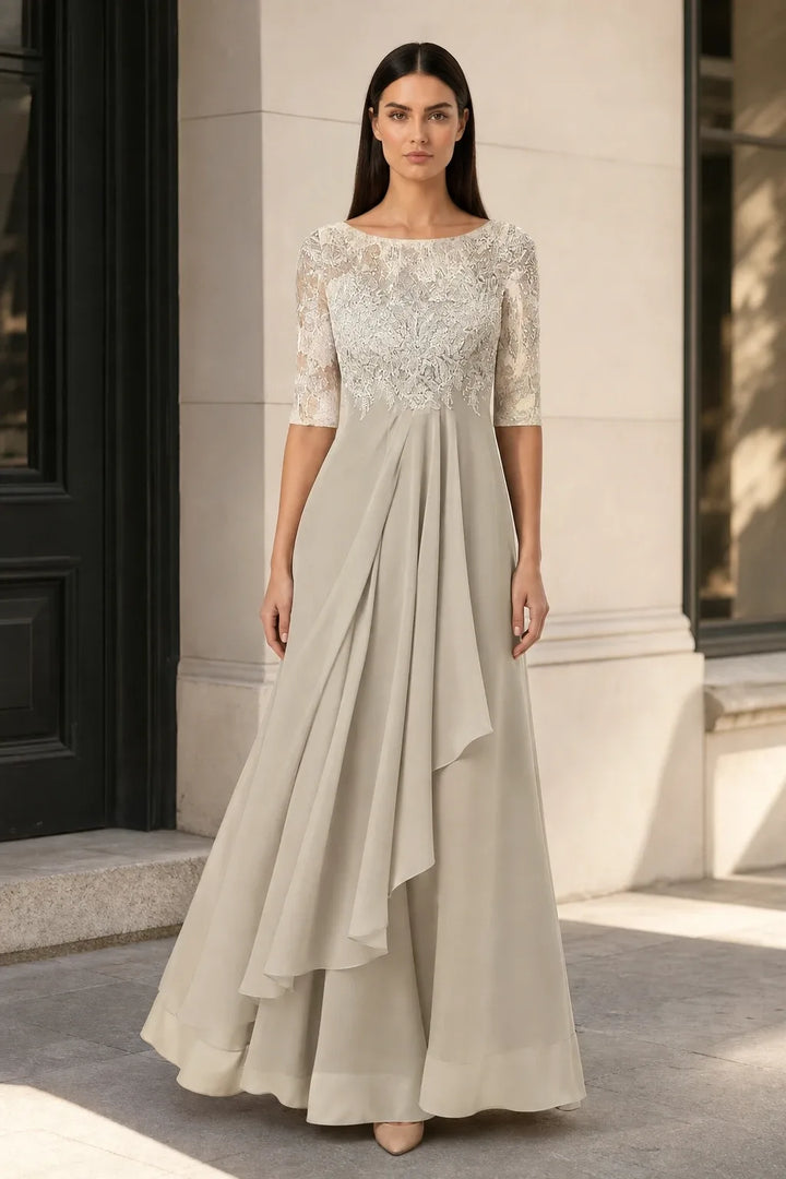 Cream lace illusion midi dress on model in contrapposto stance