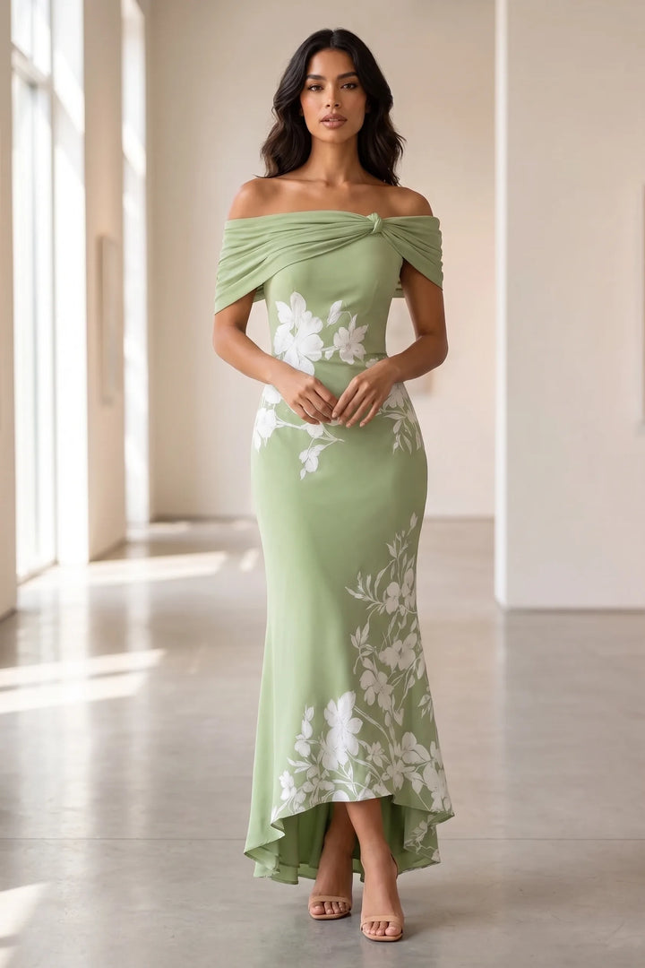 Model wearing green twist knot mermaid midi dress in lifestyle setting