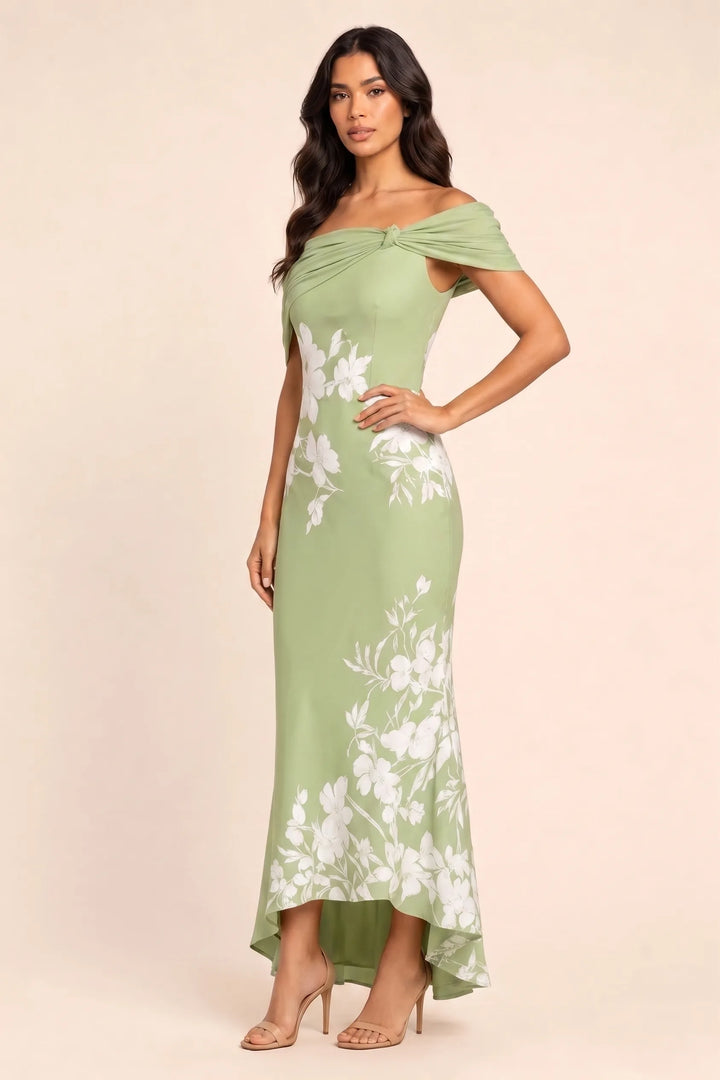 Green twist knot mermaid midi dress on model in three-quarter turn