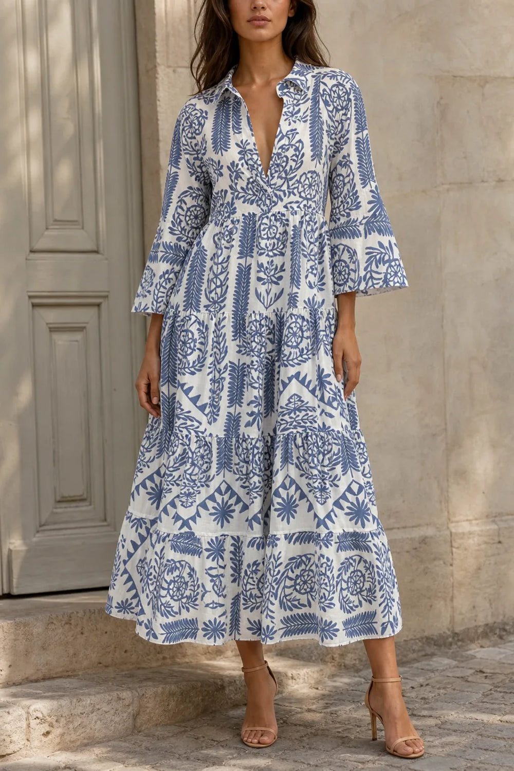 Blue boho print swing mini dress on model in contrapposto stance