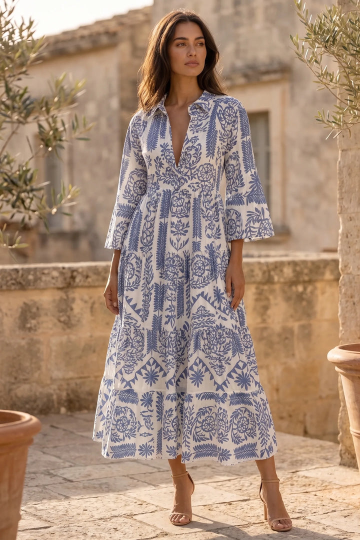 Model wearing blue boho print swing mini dress in lifestyle setting