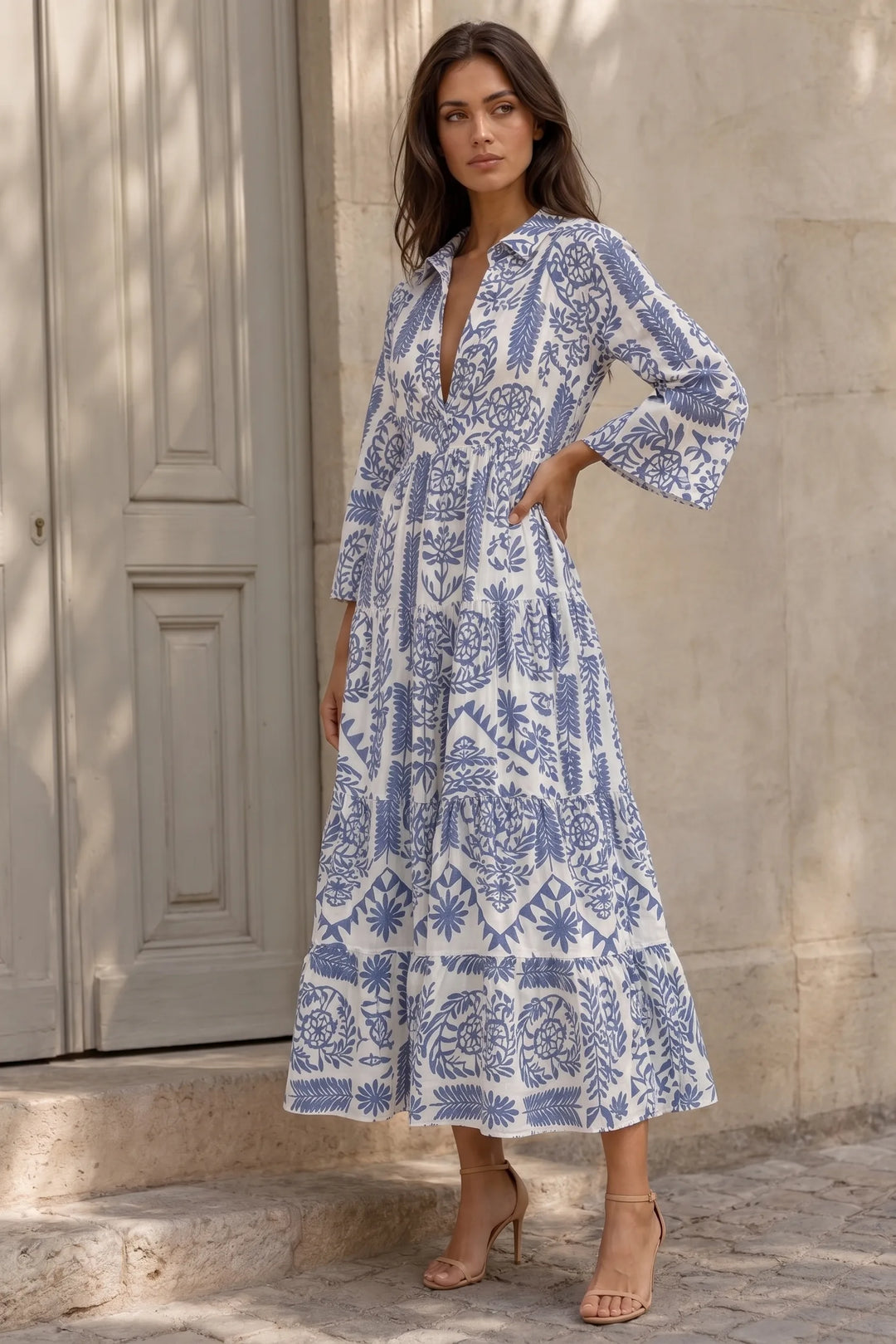 Blue boho print swing mini dress on model in three-quarter turn