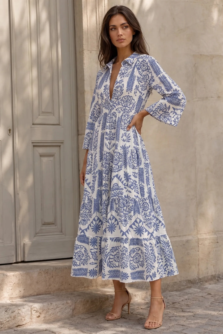 Blue boho print swing mini dress on model in three-quarter turn