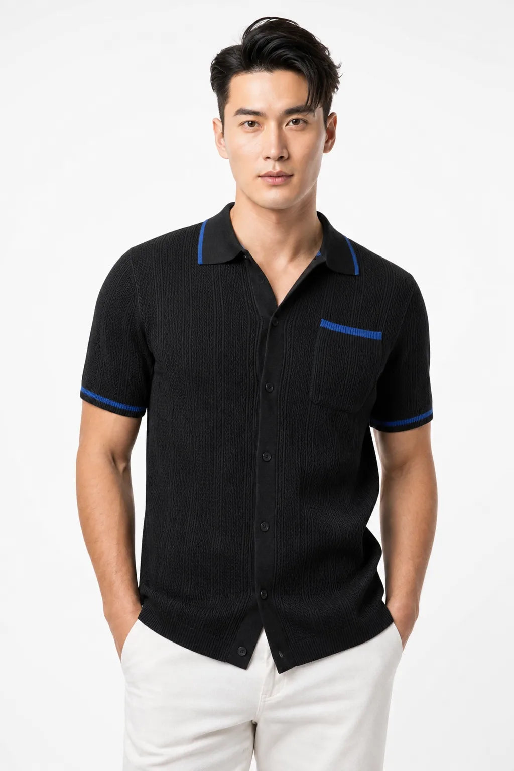 Black cable knit camp shirt on a model in a contrapposto stance