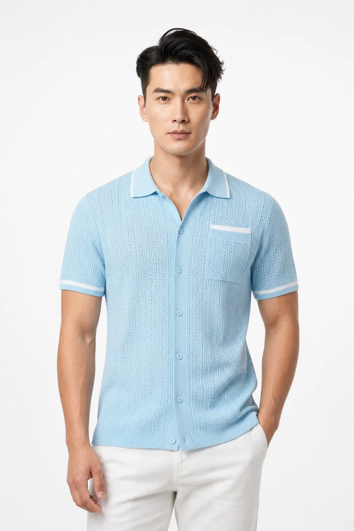 Light blue cable knit camp shirt on a model in a contrapposto stance