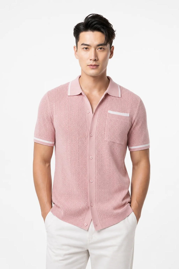 Pink cable knit camp shirt on a model in a contrapposto stance