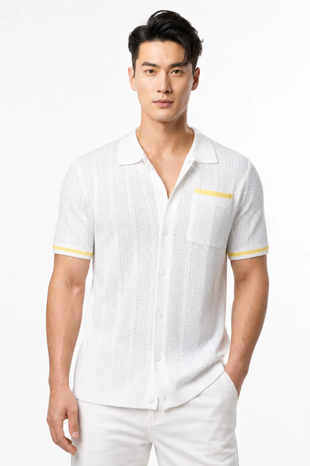 White cable knit camp shirt on a model in a contrapposto stance