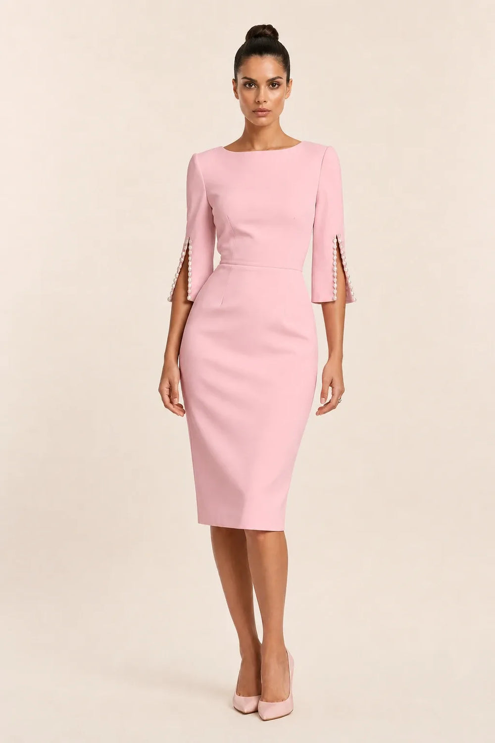 Pink midi dress with pearl-trimmed split sleeves on a model in a contrapposto stance
