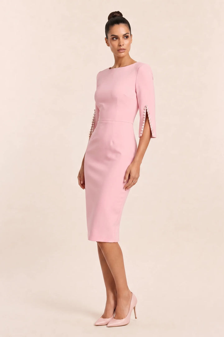 Pink midi dress with pearl-trimmed split sleeves on a model in a three-quarter turn