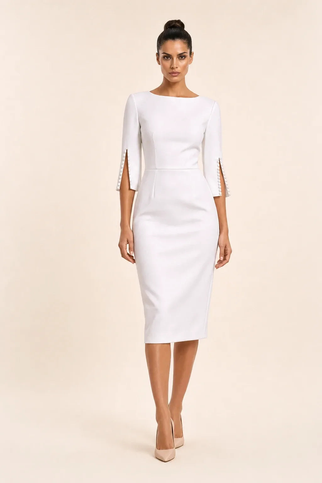 White midi dress with pearl-trimmed split sleeves on a model in a contrapposto stance