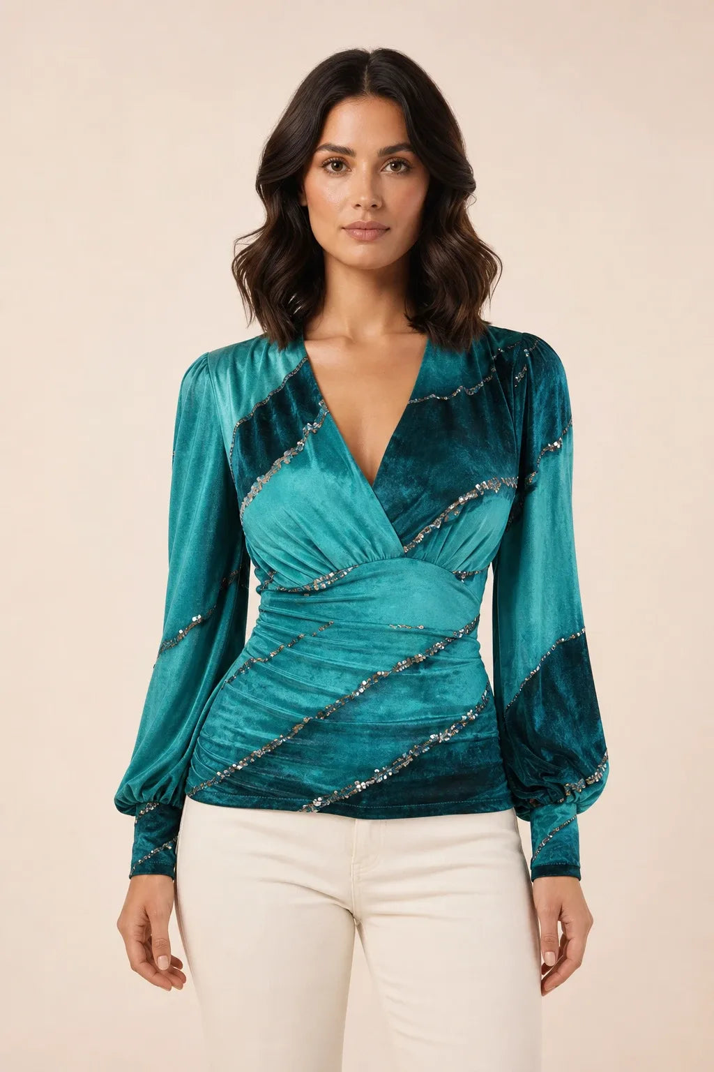 Winter teal ruched wrap blouse on model in contrapposto stance, v-neckline and gathered waist
