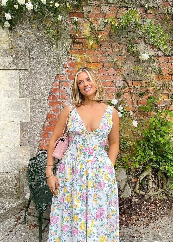 Model wearing a yellow floral corset midi dress, full-length alternate view