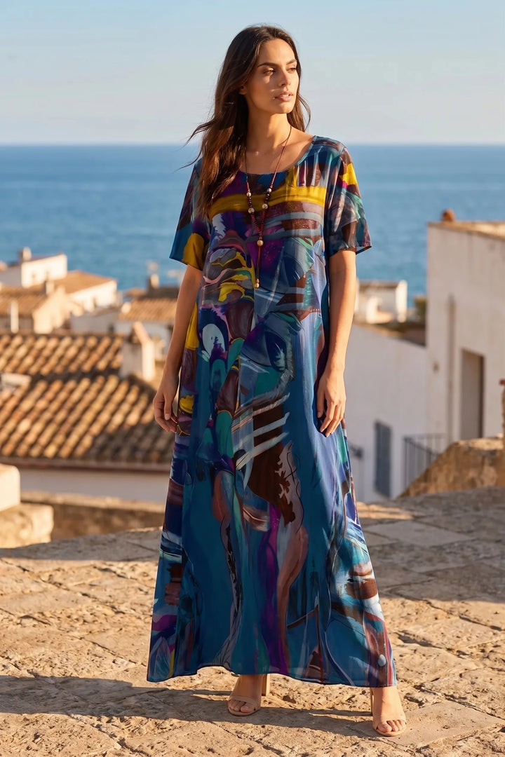 Model wearing blue abstract-print midi dress in lifestyle setting
