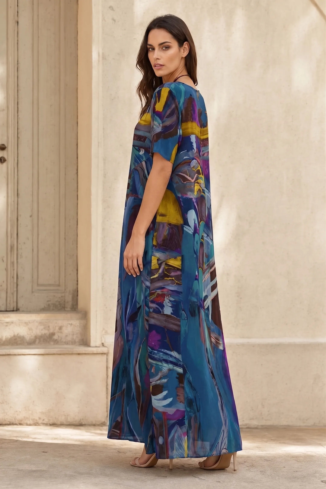 Blue abstract-print midi dress on model in three-quarter turn