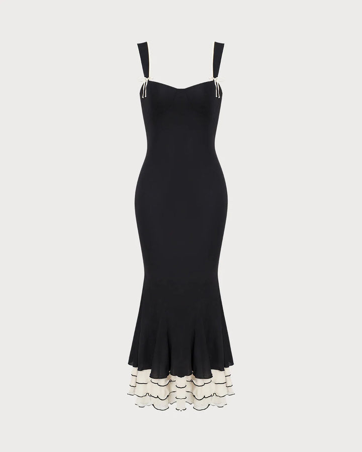 Black fitted mermaid midi dress on model, additional angle view