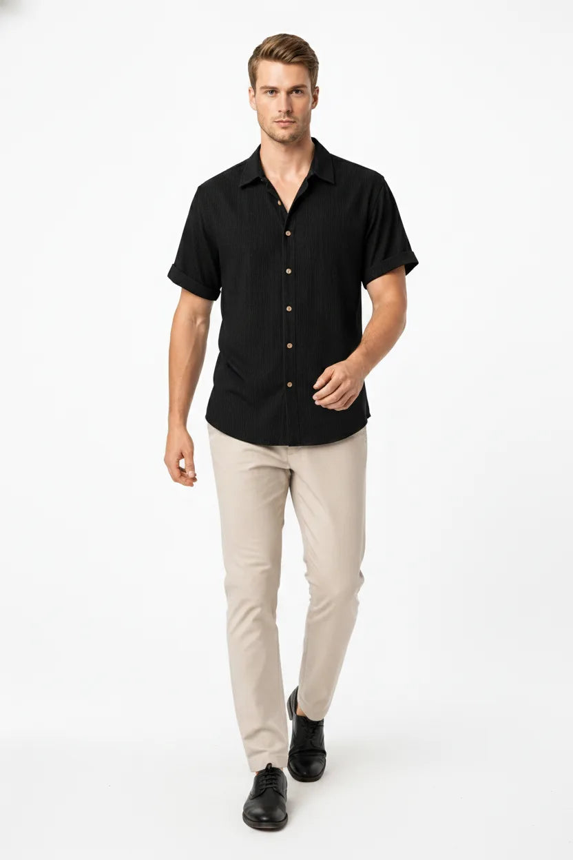 Black ribbed corduroy shirt on model in natural movement