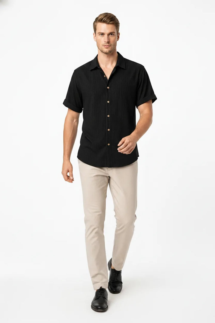 Black ribbed corduroy shirt on model in natural movement