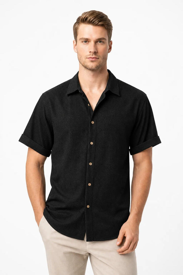 Black ribbed corduroy shirt on model in contrapposto stance