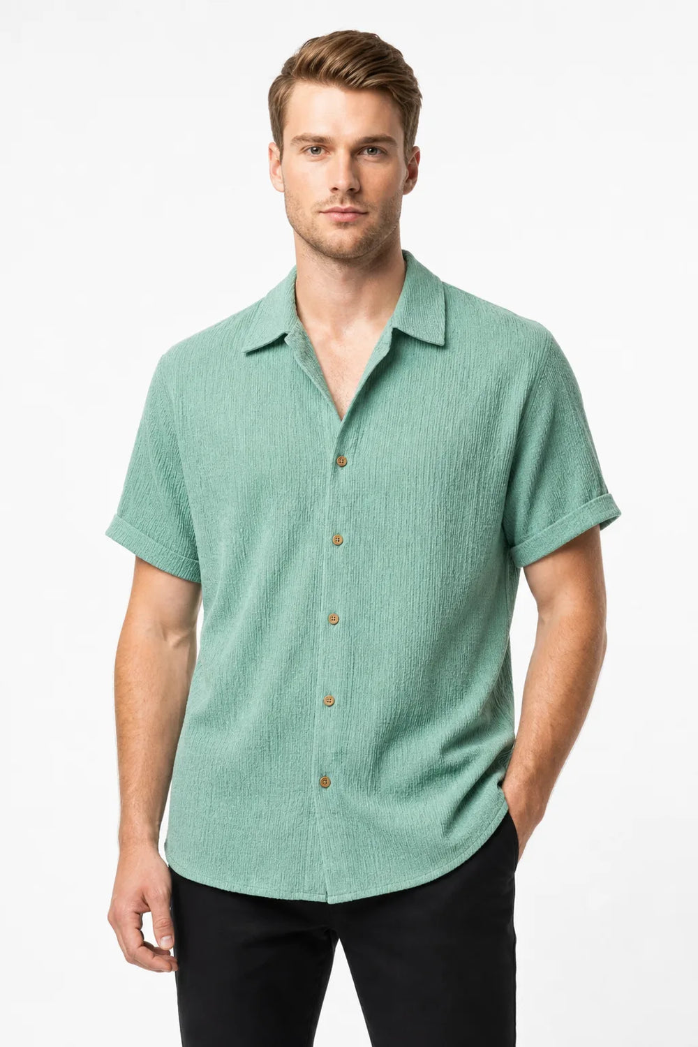Green ribbed corduroy shirt on model in contrapposto stance