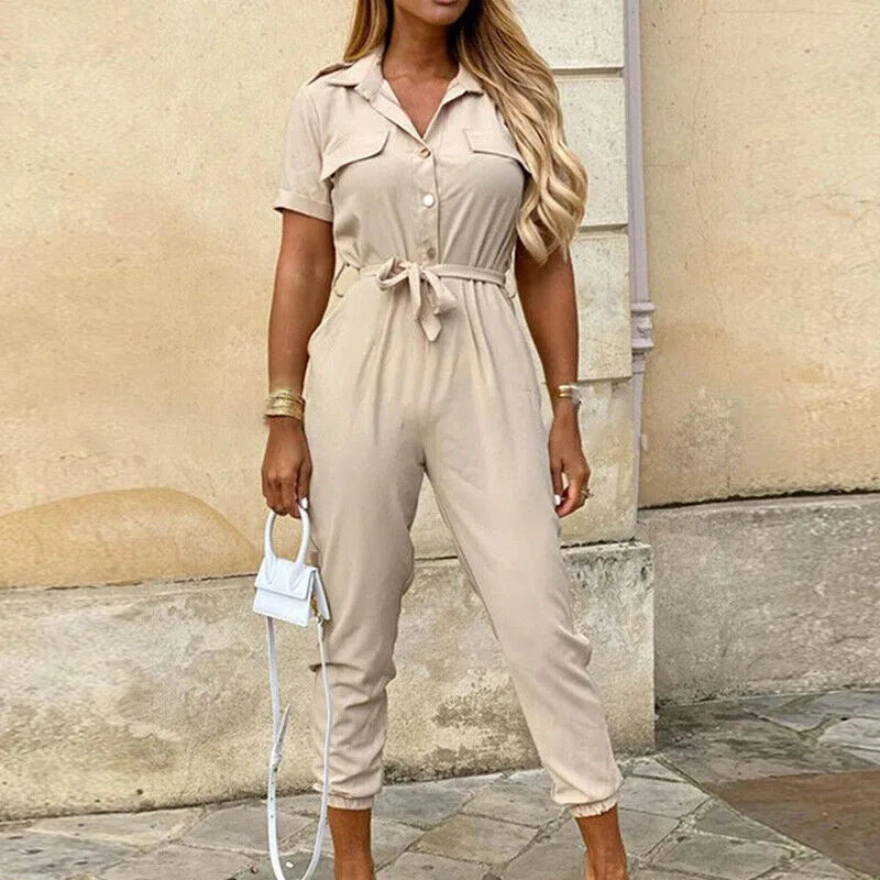 Model wearing a beige striped belted jumpsuit