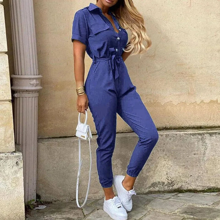 Model wearing a blue striped belted jumpsuit