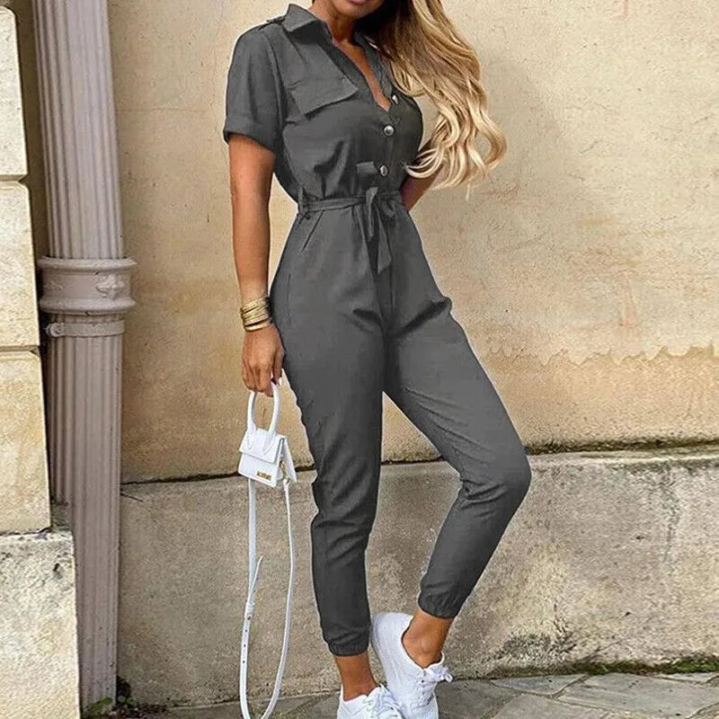Model wearing a gray striped belted jumpsuit