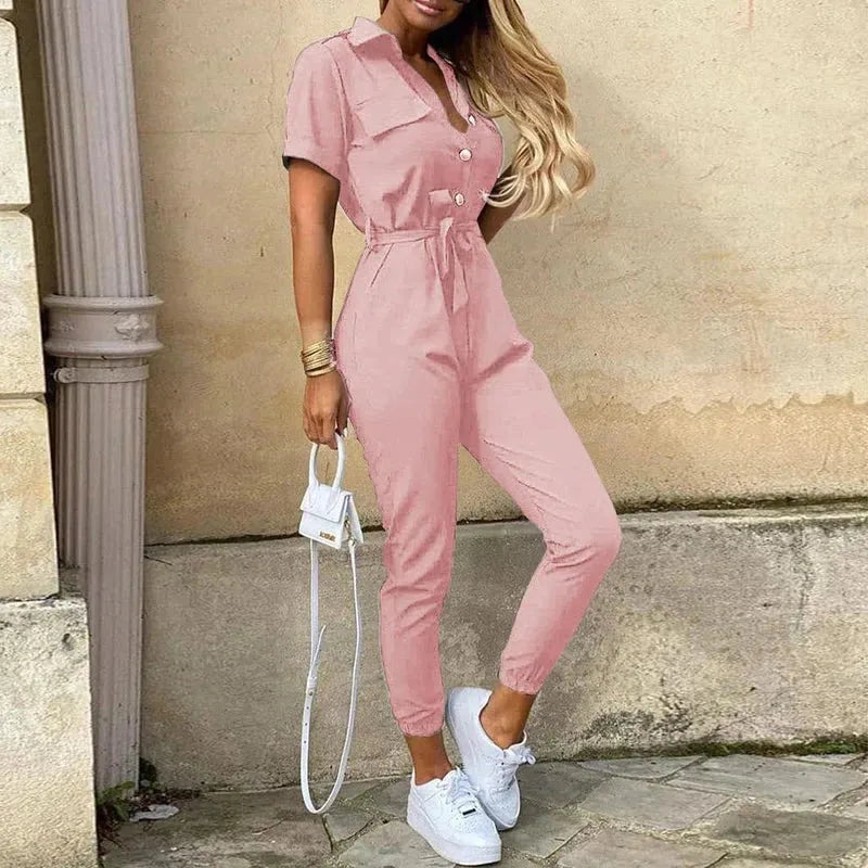 Model wearing a pink striped belted jumpsuit