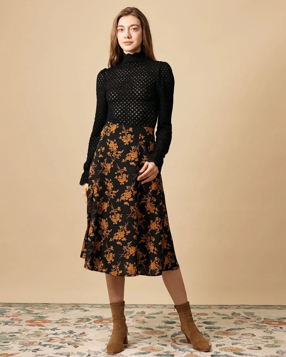 Close-up detail of floral print and front slit on black midi dress