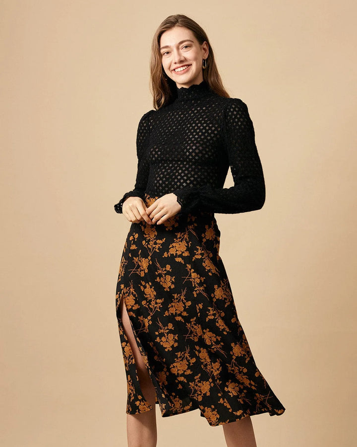 Black floral midi dress with front slit, model standing in side profile