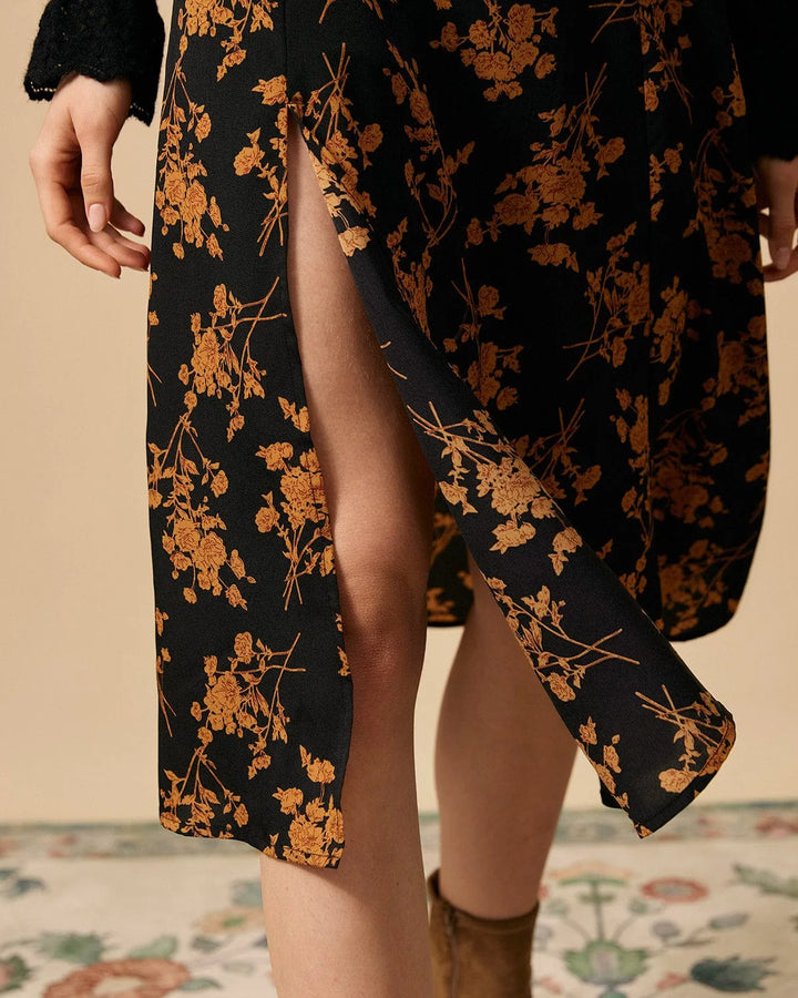 Black floral midi dress with front slit, model in three-quarter turn pose
