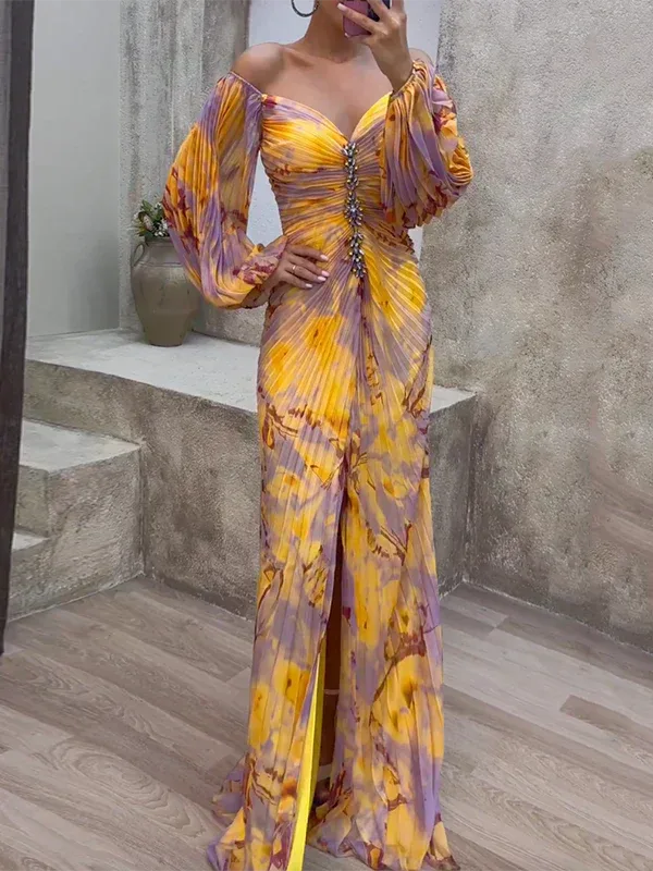 Woman in a pleated off-shoulder multicolor gown, facing forward