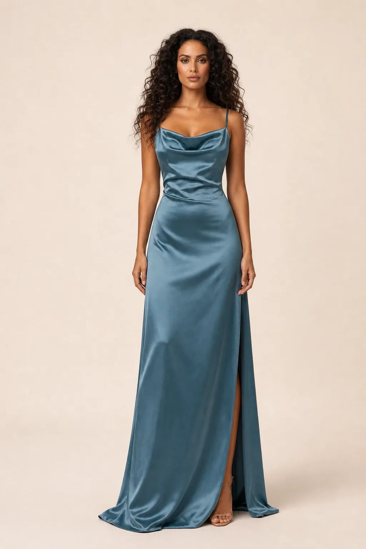 Blue cowl neck backless gown on model in contrapposto stance