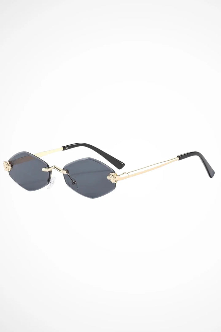 Geometric rimless gradient sunglasses in gold and black tones, front view