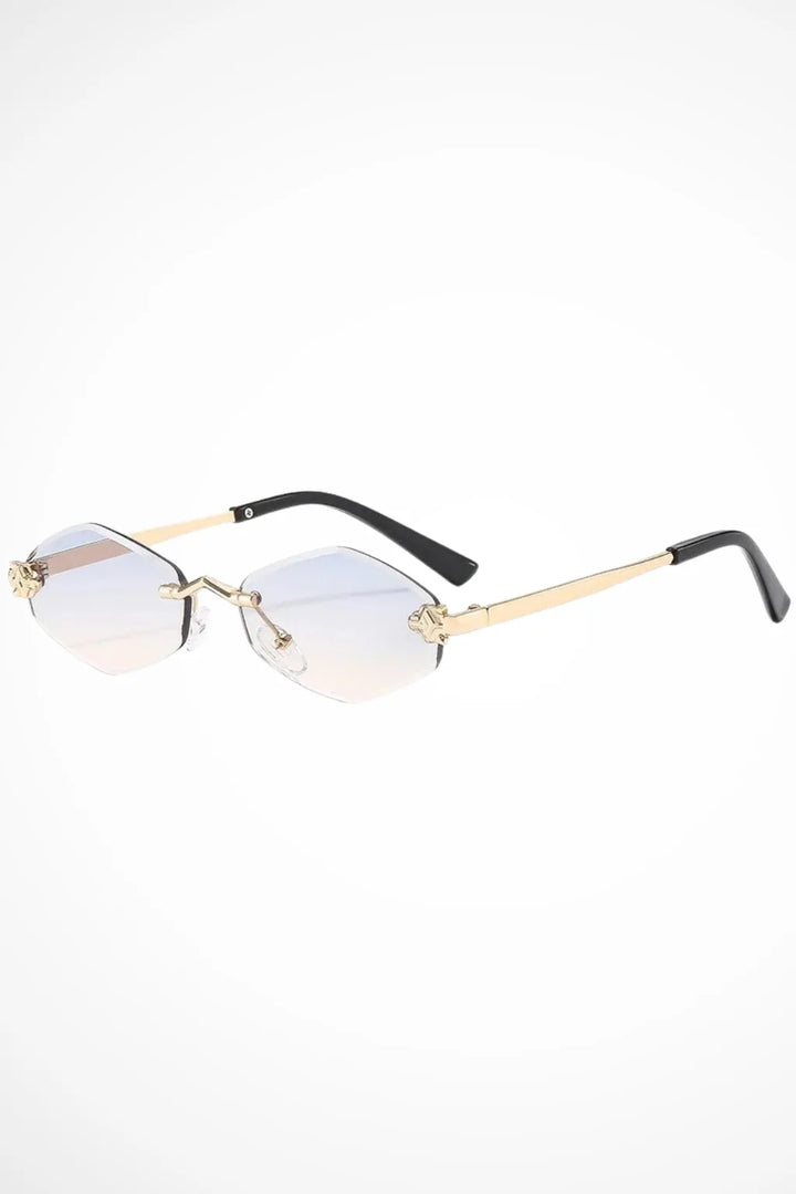 Geometric rimless gradient sunglasses in gold with blue-yellow gradient lenses, front view