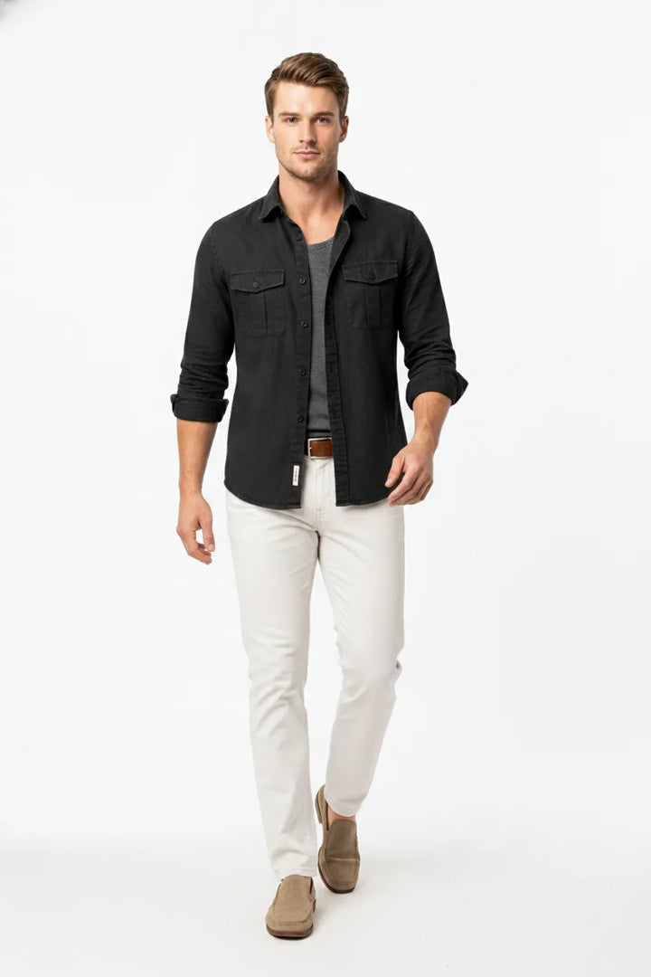 Black linen double pocket overshirt on male model in natural movement