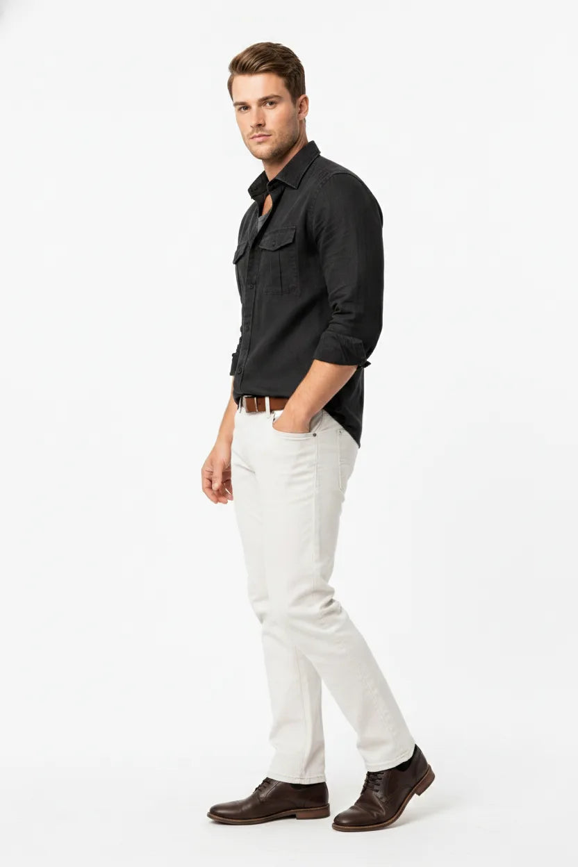 Black linen double pocket overshirt on male model at three-quarter turn