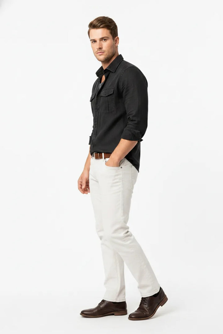 Black linen double pocket overshirt on male model at three-quarter turn