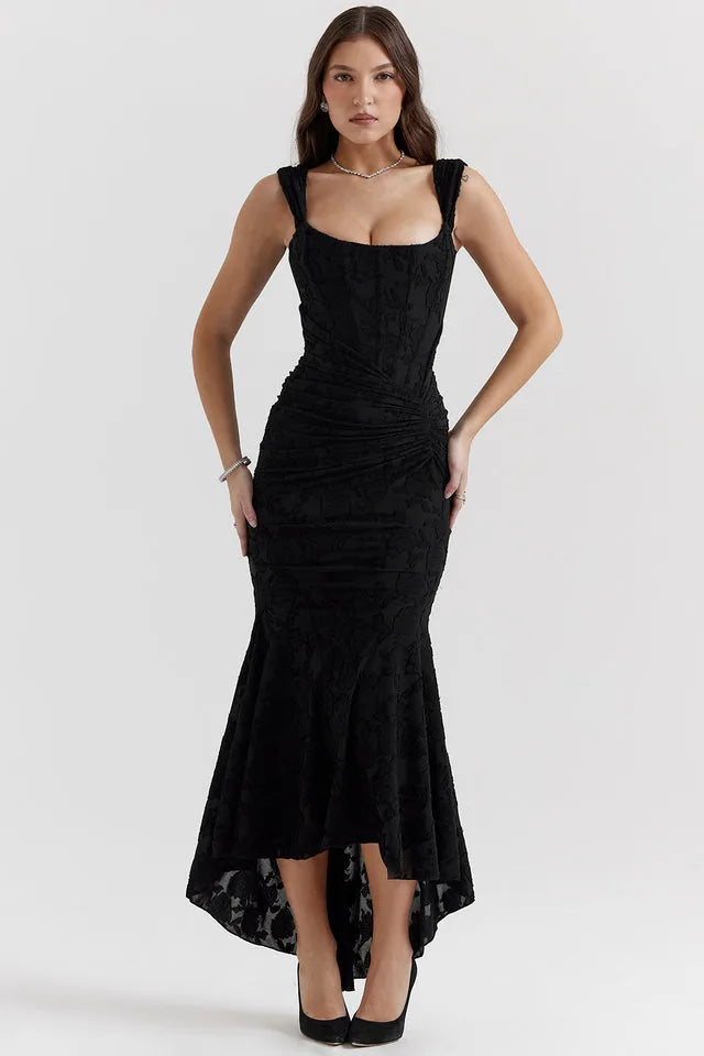 Model in a black lace mermaid gown with a fitted silhouette and flared floor-length skirt