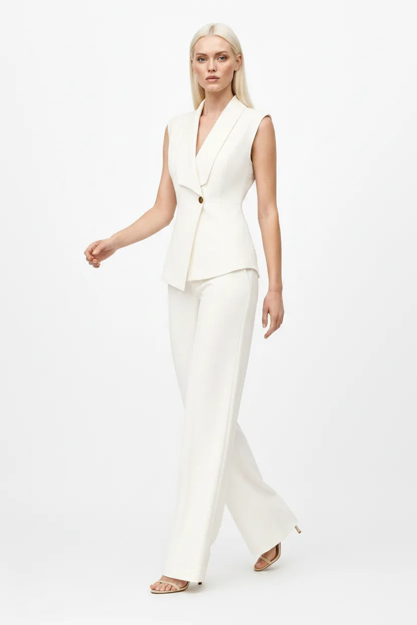 White sleeveless blazer suit on model in natural movement