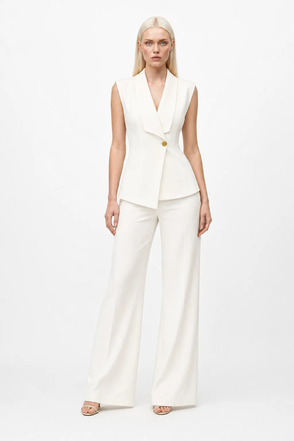 White sleeveless blazer suit on model in contrapposto stance