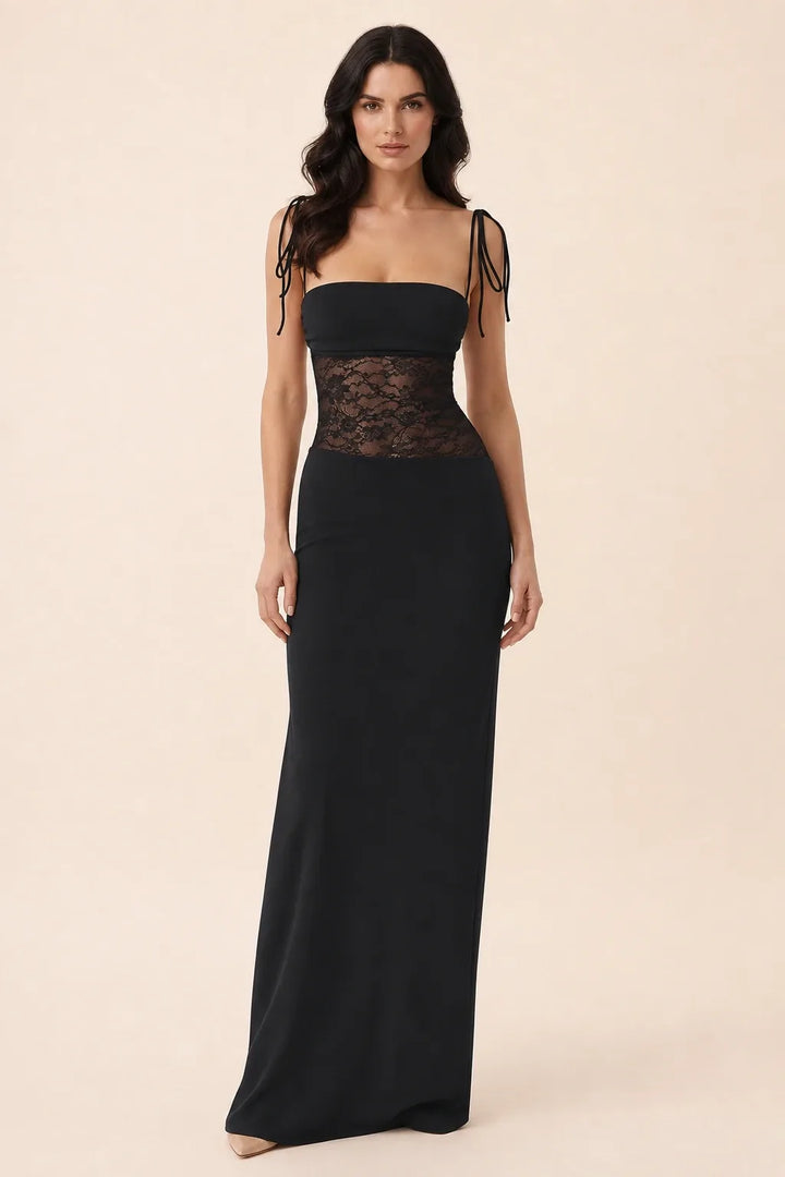 Black and red lace corset maxi dress on model in contrapposto stance