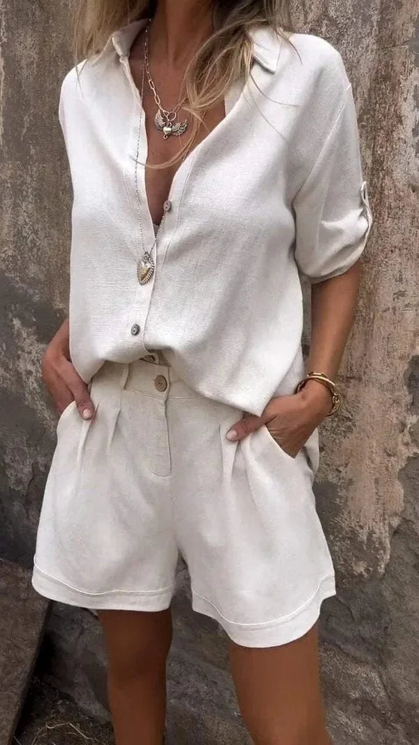 White matching shirt and shorts set, model at three-quarter turn