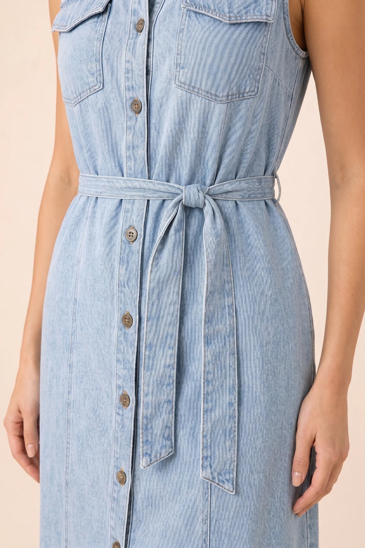 Close-up detail of a belted blue denim maxi dress