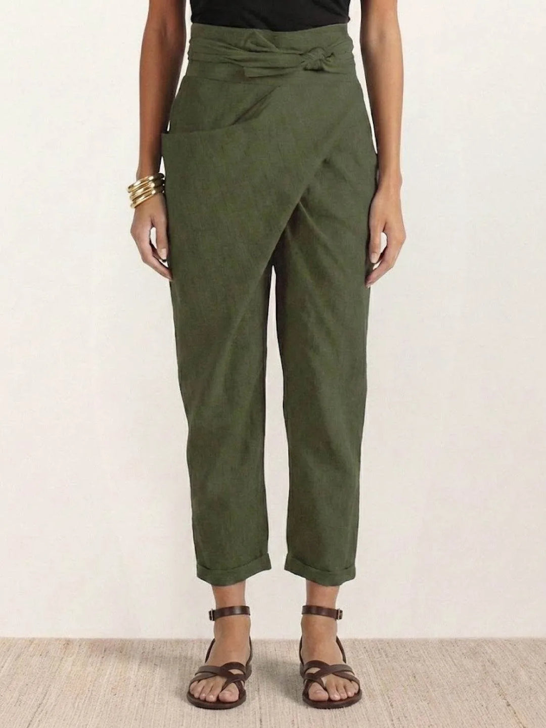 Army green wrap front tapered pants on model, full-length view